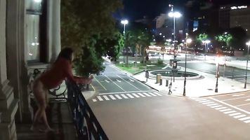Outdoor public pissing from a balcony in America